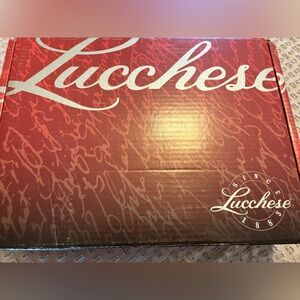 Beautiful pair of Lucchese honey brown cowhide lace up boots.